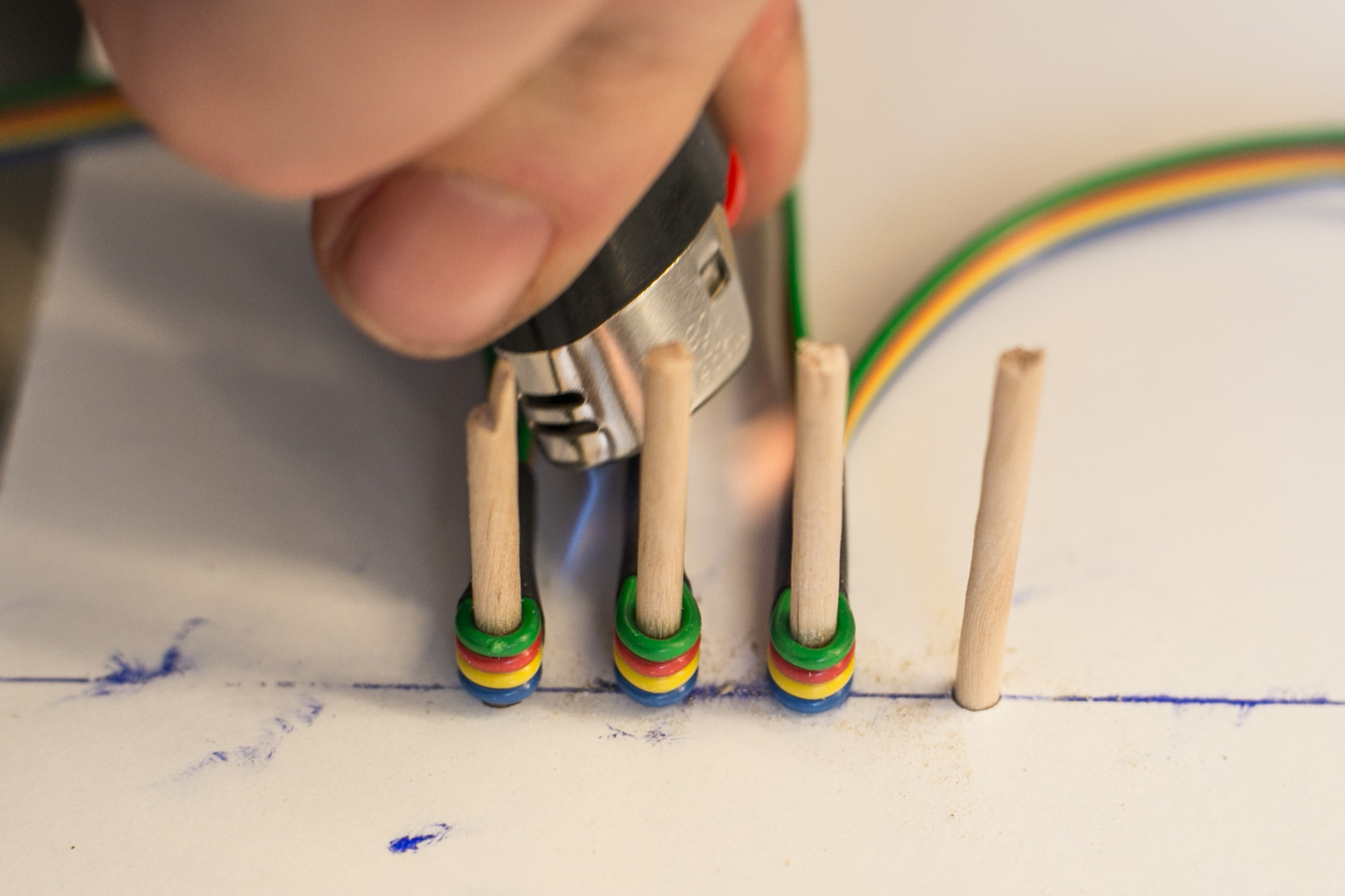 Shrink shrinking tubing with lighter while cable is attached to template